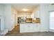 Modern kitchen with white cabinets and granite countertops at 13 Forest Ridge Ct, Sandy Springs, GA 30350