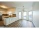 Bright kitchen with island, granite counters, and hardwood floors at 13 Forest Ridge Ct, Sandy Springs, GA 30350