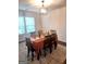 Formal dining room featuring a large table and hardwood floors at 6258 Ellenwood Dr, Rex, GA 30273