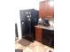 Kitchen with black appliances and brown cabinets at 6258 Ellenwood Dr, Rex, GA 30273