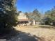 Rustic stone building with gas pump and outbuildings at 3449 Highway 138 Ne, Conyers, GA 30013