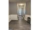 Bright hallway with gray walls, white trim, and gray flooring at 6022 Centennial Run, Atlanta, GA 30349