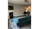 Living room with fireplace and teal couch at 6022 Centennial Run, Atlanta, GA 30349