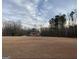House situated on a large lot with mature trees nearby at 216 Rivers Rd, Fayetteville, GA 30214