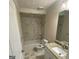 Clean bathroom with marble tile and shower/tub combo at 216 Rivers Rd, Fayetteville, GA 30214