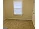 Simple bedroom with neutral colored walls and carpet at 216 Rivers Rd, Fayetteville, GA 30214