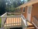 White deck with stairs leading to the back door of the home at 216 Rivers Rd, Fayetteville, GA 30214