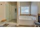 Bathroom features a large shower and a separate tub at 417 Creekside Park, Covington, GA 30014