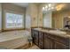 Elegant bathroom with double vanity and soaking tub at 417 Creekside Park, Covington, GA 30014