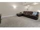Spacious basement recreation room with plush seating at 801 Carnegie Ct, Locust Grove, GA 30248