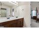 Bathroom with double vanity and a view of bedroom at 801 Carnegie Ct, Locust Grove, GA 30248