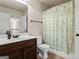 Clean bathroom with single vanity, toilet and shower/tub combo at 801 Carnegie Ct, Locust Grove, GA 30248