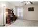 Bedroom with desk and chair, carpeted floors and window with curtains at 801 Carnegie Ct, Locust Grove, GA 30248
