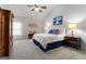 Large bedroom with a king-size bed and dresser at 801 Carnegie Ct, Locust Grove, GA 30248