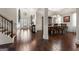 Formal dining room with hardwood floors and elegant light fixture at 801 Carnegie Ct, Locust Grove, GA 30248