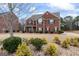 Two-story house with a brick facade and mature landscaping at 801 Carnegie Ct, Locust Grove, GA 30248