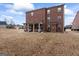 Brick house with a large backyard and patio at 801 Carnegie Ct, Locust Grove, GA 30248