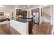Island kitchen with stainless steel appliances and granite countertops at 801 Carnegie Ct, Locust Grove, GA 30248