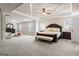 Large main bedroom with sitting area and tray ceiling at 801 Carnegie Ct, Locust Grove, GA 30248