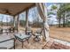 Relaxing covered patio with outdoor furniture at 801 Carnegie Ct, Locust Grove, GA 30248