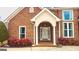 Brick front porch with arched entryway and columns at 320 Oakpark Ter, Mcdonough, GA 30253