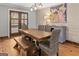 Rustic wooden dining table with bench seating in bright dining room at 315 Countryside, Mcdonough, GA 30252