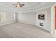 Main bedroom with fireplace and tray ceiling at 5615 Forkwood Nw Dr, Acworth, GA 30101