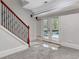 Basement with a staircase, french doors leading outside, and grey carpeting at 180 Wesley Forest Dr, Fayetteville, GA 30214