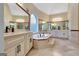 Bathroom boasts a large soaking tub and double vanity at 180 Wesley Forest Dr, Fayetteville, GA 30214