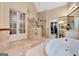 Spa-like bathroom with walk in shower, soaking tub, and stained glass at 180 Wesley Forest Dr, Fayetteville, GA 30214