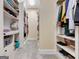 Large walk-in closet with ample shelving and storage space at 180 Wesley Forest Dr, Fayetteville, GA 30214