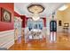 Elegant dining room features hardwood floors, a large table, and a stunning chandelier at 180 Wesley Forest Dr, Fayetteville, GA 30214