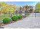 Gated entrance to a luxurious home with a fountain at 180 Wesley Forest Dr, Fayetteville, GA 30214