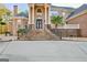 Grand brick home with ornate entryway and stone staircase at 180 Wesley Forest Dr, Fayetteville, GA 30214