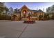 Elegant two-story home with fountain and circular driveway at 180 Wesley Forest Dr, Fayetteville, GA 30214