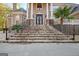 Elegant entryway with wrought iron doors and stone steps at 180 Wesley Forest Dr, Fayetteville, GA 30214