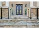 Ornate double doors with stone steps and landscaping at 180 Wesley Forest Dr, Fayetteville, GA 30214