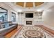 Gathering room with hardwood floors, fireplace, and built-in shelving at 180 Wesley Forest Dr, Fayetteville, GA 30214