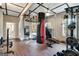 Spacious home gym with various equipment and natural light at 180 Wesley Forest Dr, Fayetteville, GA 30214