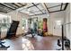 Home gym with various workout equipment including treadmill and punching bag at 180 Wesley Forest Dr, Fayetteville, GA 30214