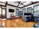 Home office with hardwood floors, large windows and a view into the dining room at 180 Wesley Forest Dr, Fayetteville, GA 30214