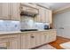 Elegant kitchen boasts custom cabinetry, a gas cooktop, and marble backsplash at 180 Wesley Forest Dr, Fayetteville, GA 30214