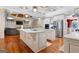 Spacious kitchen with island, stainless steel appliances, and hardwood floors at 180 Wesley Forest Dr, Fayetteville, GA 30214