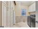 Laundry room with custom cabinetry, a refrigerator and washer/dryer at 180 Wesley Forest Dr, Fayetteville, GA 30214