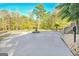 Large patio area with a fountain and lush landscaping at 180 Wesley Forest Dr, Fayetteville, GA 30214