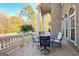 Covered patio with seating area and wooded views at 180 Wesley Forest Dr, Fayetteville, GA 30214