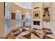 Cozy sitting area with hardwood floors, fireplace, and built-in shelving at 180 Wesley Forest Dr, Fayetteville, GA 30214