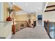 Upstairs hallway with carpeting and wrought iron railing at 180 Wesley Forest Dr, Fayetteville, GA 30214