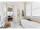 Stylish bathroom with a soaking tub, modern fixtures, and a view of the bedroom at 0 Pinegate Way, Sharpsburg, GA 30277