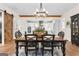 Bright dining room with rustic table, modern chandelier, and easy access to the kitchen at 0 Pinegate Way, Sharpsburg, GA 30277